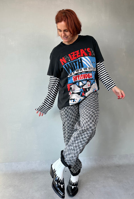 Geblokte jeans met asymmetrische sluiting