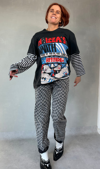 Geblokte jeans met asymmetrische sluiting