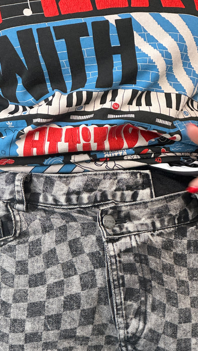 Geblokte jeans met asymmetrische sluiting