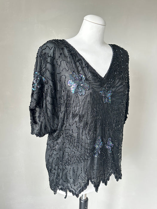 Zwarte kraaltjes top