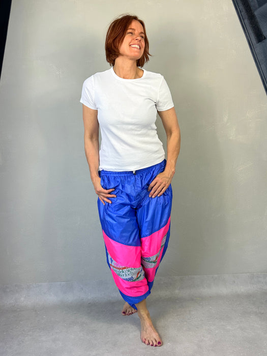 Blauwe 80's trainingsbroek met zuurstok roze