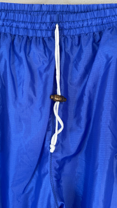 Blauwe 80's trainingsbroek met zuurstok roze