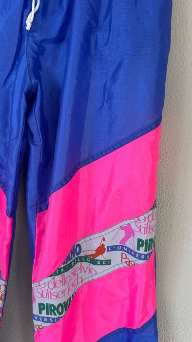 Blauwe 80's trainingsbroek met zuurstok roze